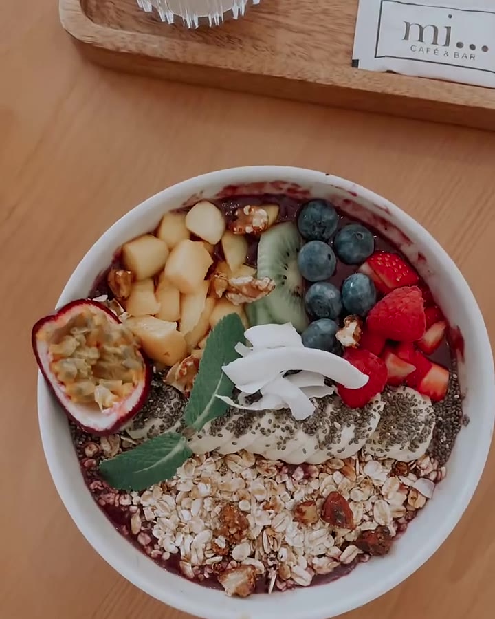 Açaí bowl topped with fruit at mi. cafe & bar